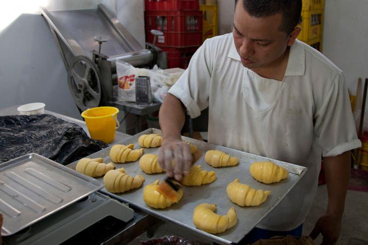 Man working in a bakery near Barranquilla, Colombia.