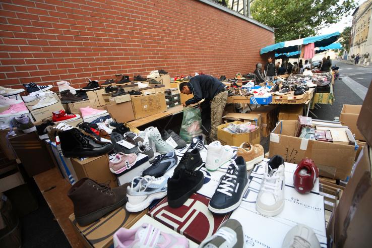 Youth entrepreneur working at shoe business in France