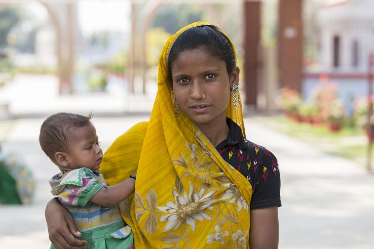 Woman holds baby