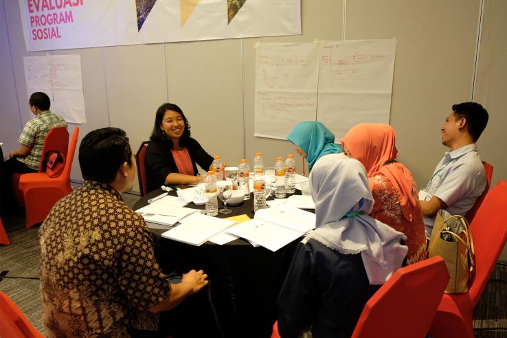 A discussion group seated at a round table