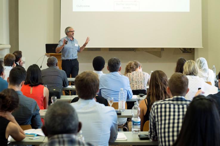 Audience watches a presentation