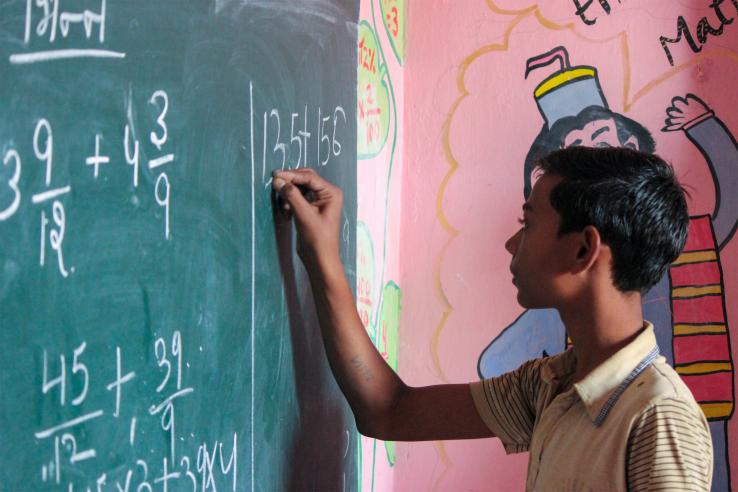 A student in a classroom in India.