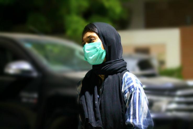 Pakistani woman wearing a face mask to prevent against Coronavirus