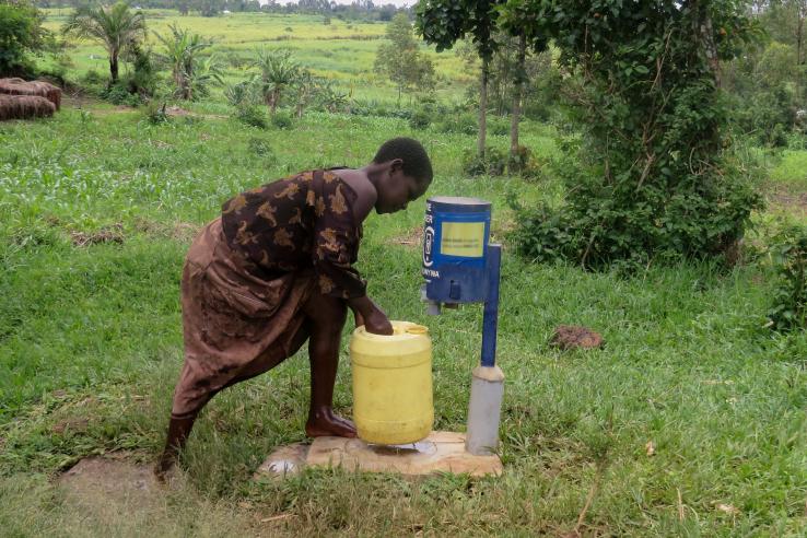 Boy using a chlorine dispenser