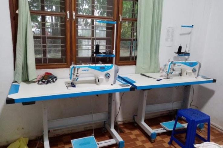 Two sewing machines in a factory in Myanmar