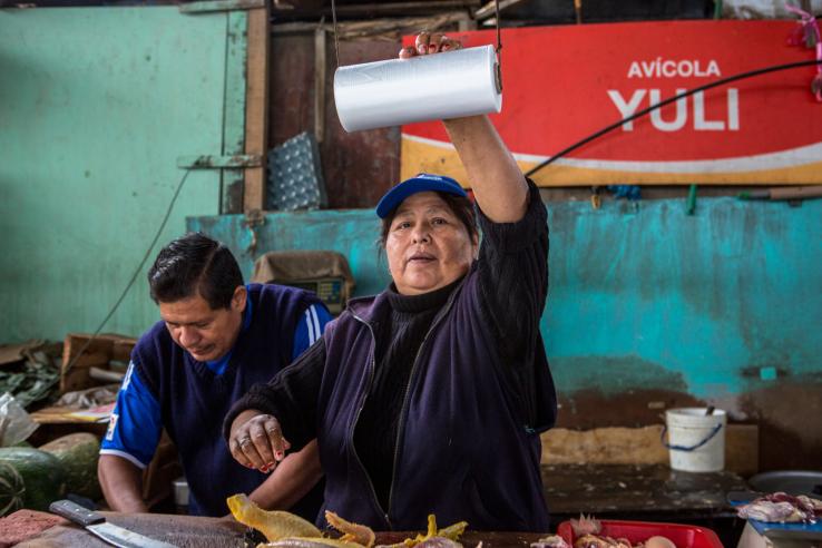 Husband and wife poultry vendors at informal market