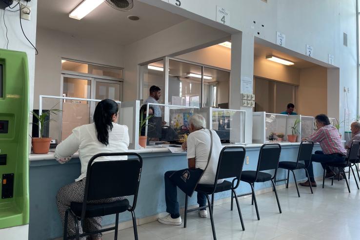 Group of people in waiting room, in Mexico.