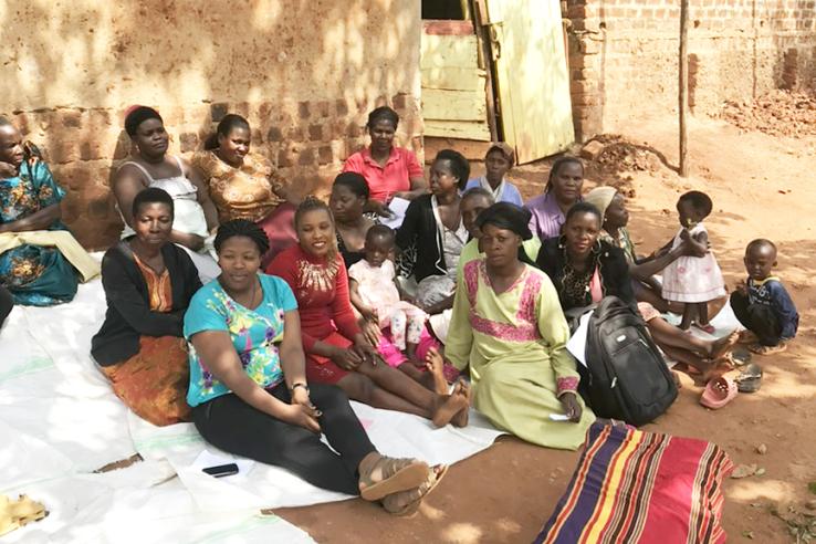 A women's microfinance group sitting