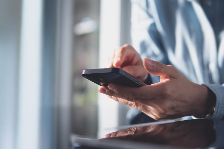 Close up, business woman using mobile smart phone