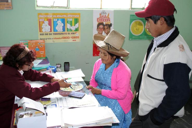 Peruvian woman receives educational information on healthcare services from trained counselor in Peru
