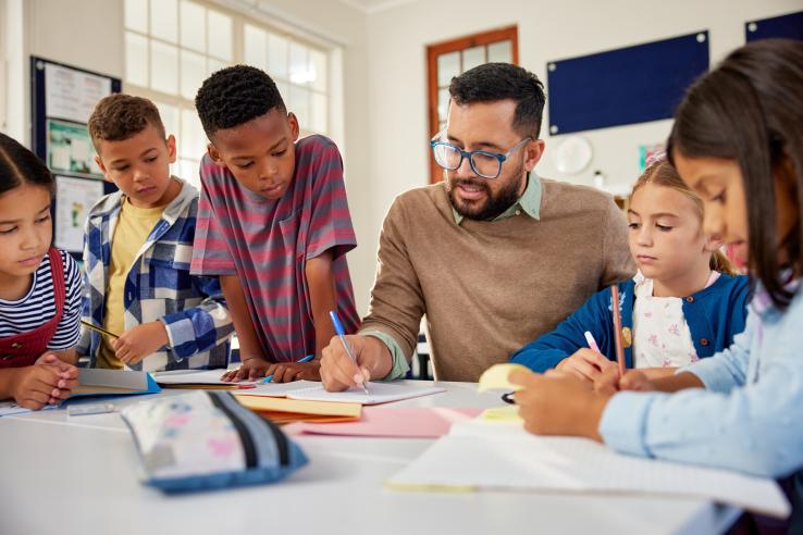 Professor teaching students, United States J-PAL North America evaluation summary