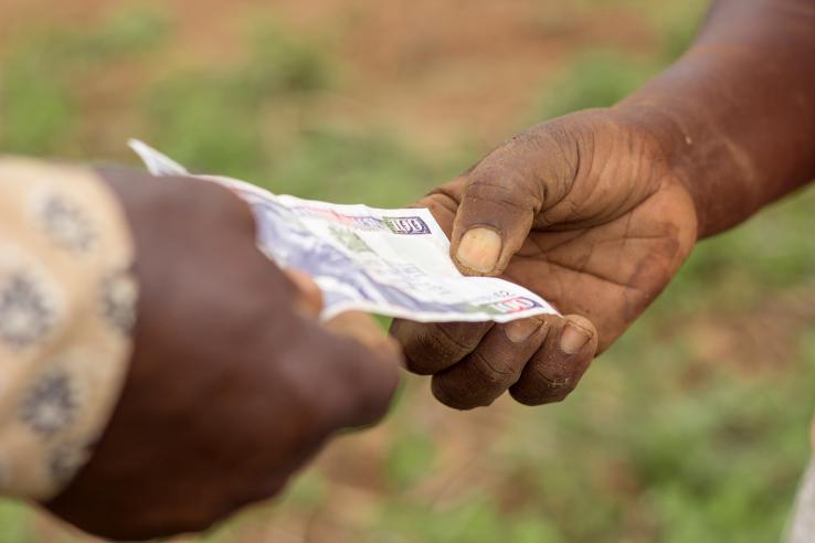 Two people exchanging money