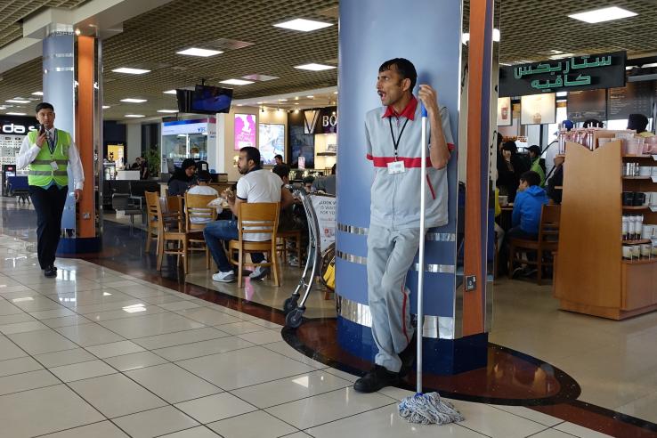 Custodial staff standing 