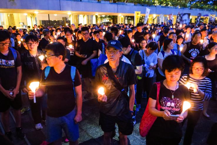 Protest movement with crowd holding candles in China