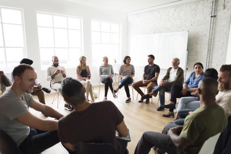 Community members engage in group discussion about policy attitudes in the United States