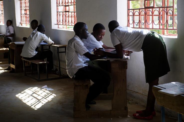 Private secondary school students working on tasks as a group in Uganda