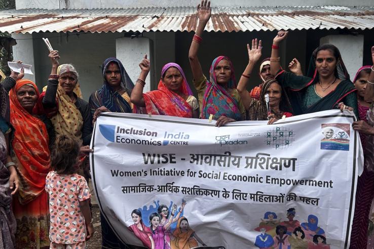 A group of women holding an initiative sign