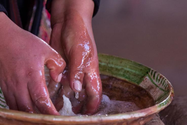 A person washing hands