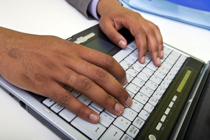 Indian man typing