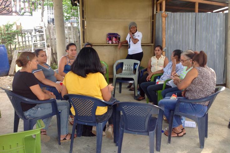 women sit in circle group meeting dominican republic credit score digital