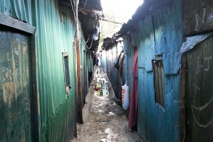 Narrow mud passage between corrugated walls