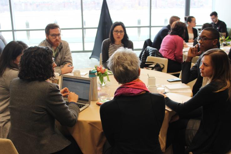 Participants at a convening for the State and Local Innovation Initiative discuss open questions around developing evaluations during a breakout session.