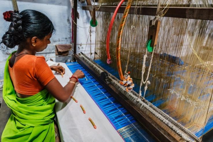 woman working on a loom