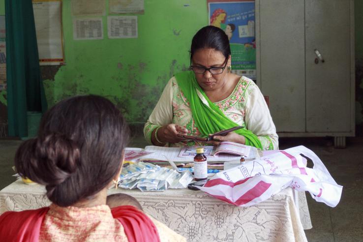 A nurse and patient in a clinic in India