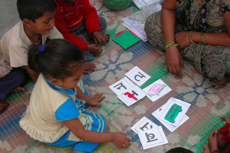 Young child playing with cares