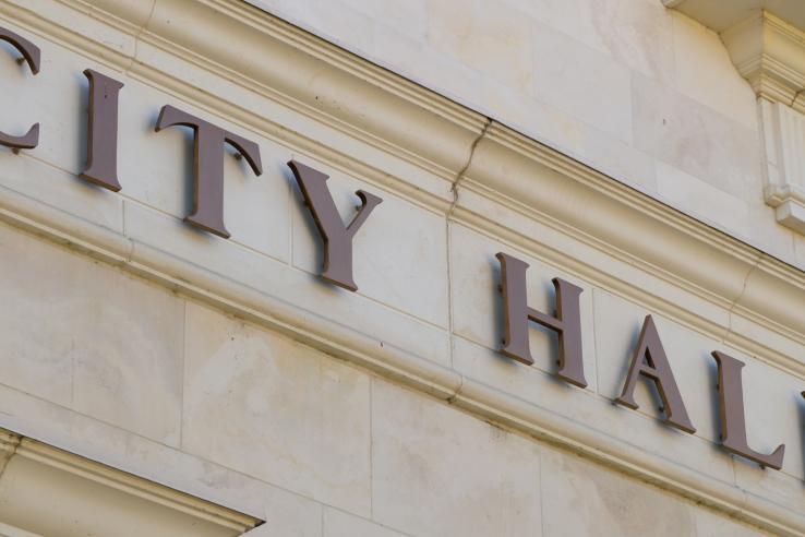 The outside of a city hall building.