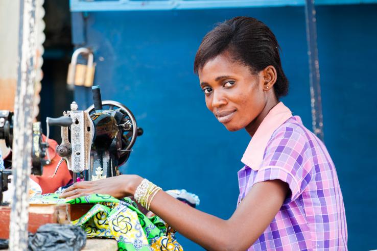 Woman works with a sewing machine in Ghana