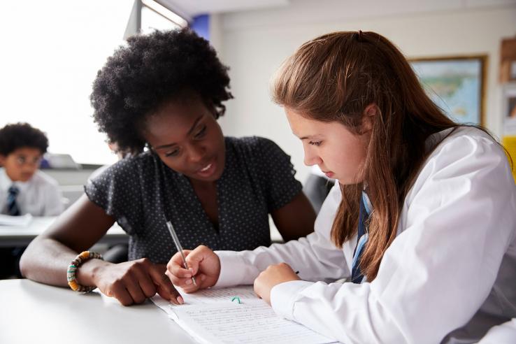 Tutor works with student.