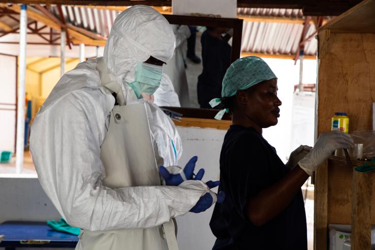 Health care workers in Sierra Leone put on personal protective equipment during the 2014-16 Ebola outbreak.