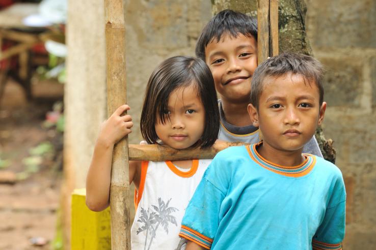 Three children smiling