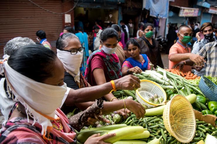 Masked buyers at a vegetable market in India during the Covid-19 pandemic