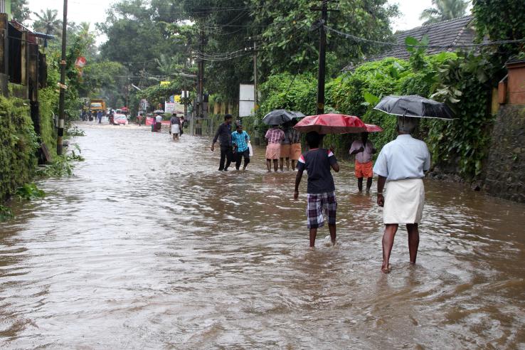 People walking through flood 