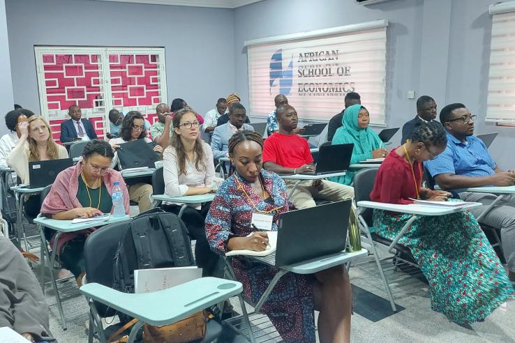 A classroom of students listens to a lecture.