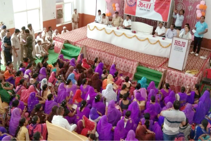 Community members attend a meeting promoting the use of women's help desks.