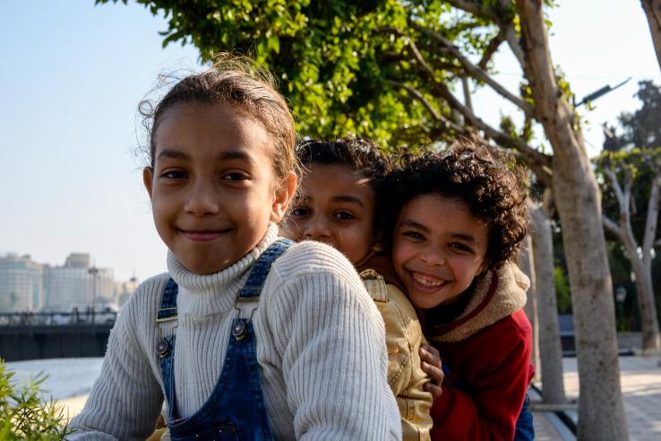 Three Egyptian Kids Smiling in Park