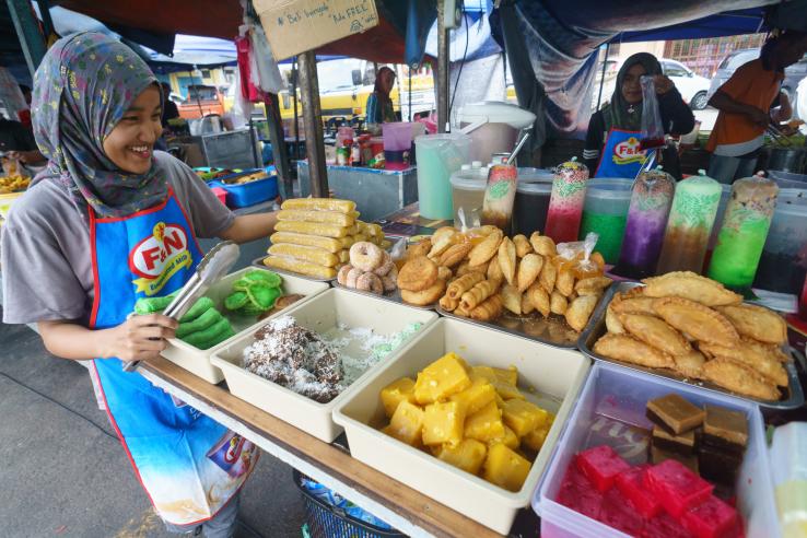 Woman looking at produce at market