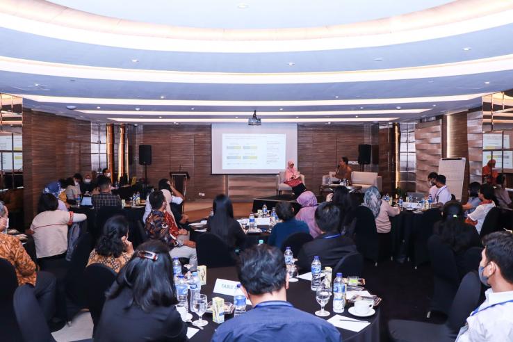 Participants sitting at table at J-PAL SEA’s learning collaborative forum in Indonesia