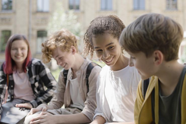 A group of young friends talk to each other