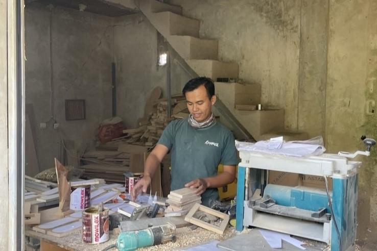 A craft store employee in Cianjur, West Java. 