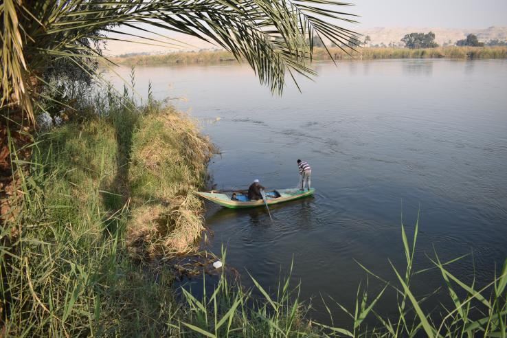 Two men in boat in river