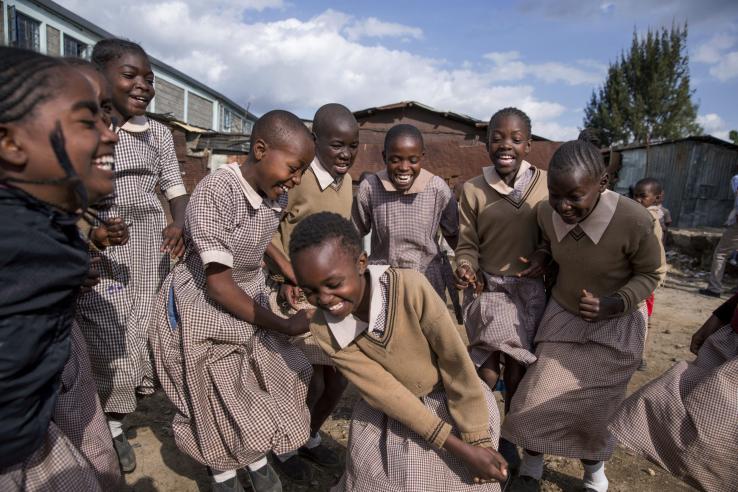 A group of girls are pictured in school uniforms. 