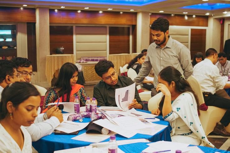 Participants Discuss at a Workshop