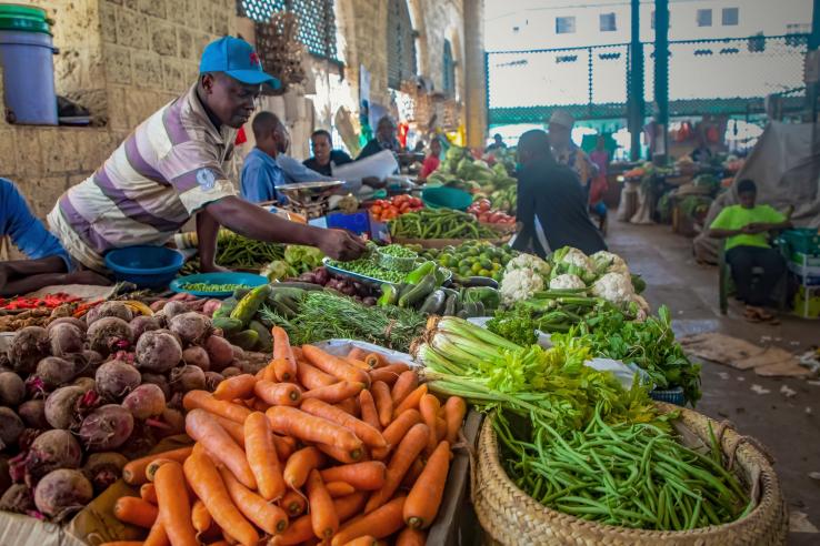 Farmer selling produce at market