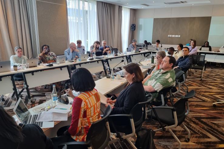 A meeting in a large conference room