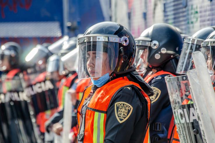 Group of police officers with shields on the streets