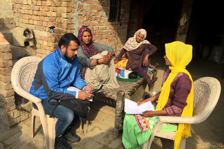 Enumerator administering a child verification survey
